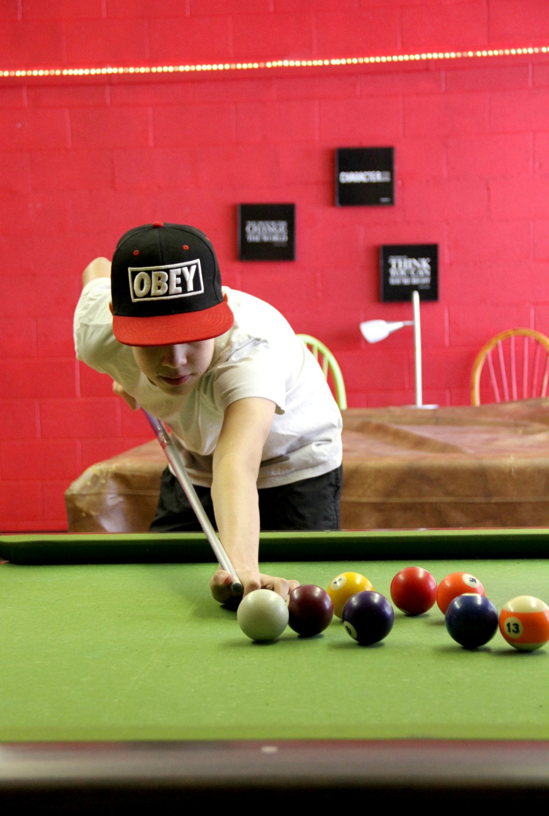 Andrew Boy playing pool at the drop in